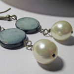 Blue Lentil Shell with White Glass Pearl Drop Dangle Earrings Laying Down