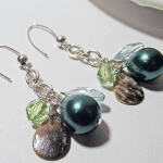Green Glass Pearl Dangle Chain Hanging Earrings Laying Down