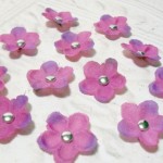 Set of 12 Purple Artificial Silk Flower Brad Centered Craft Embellishment